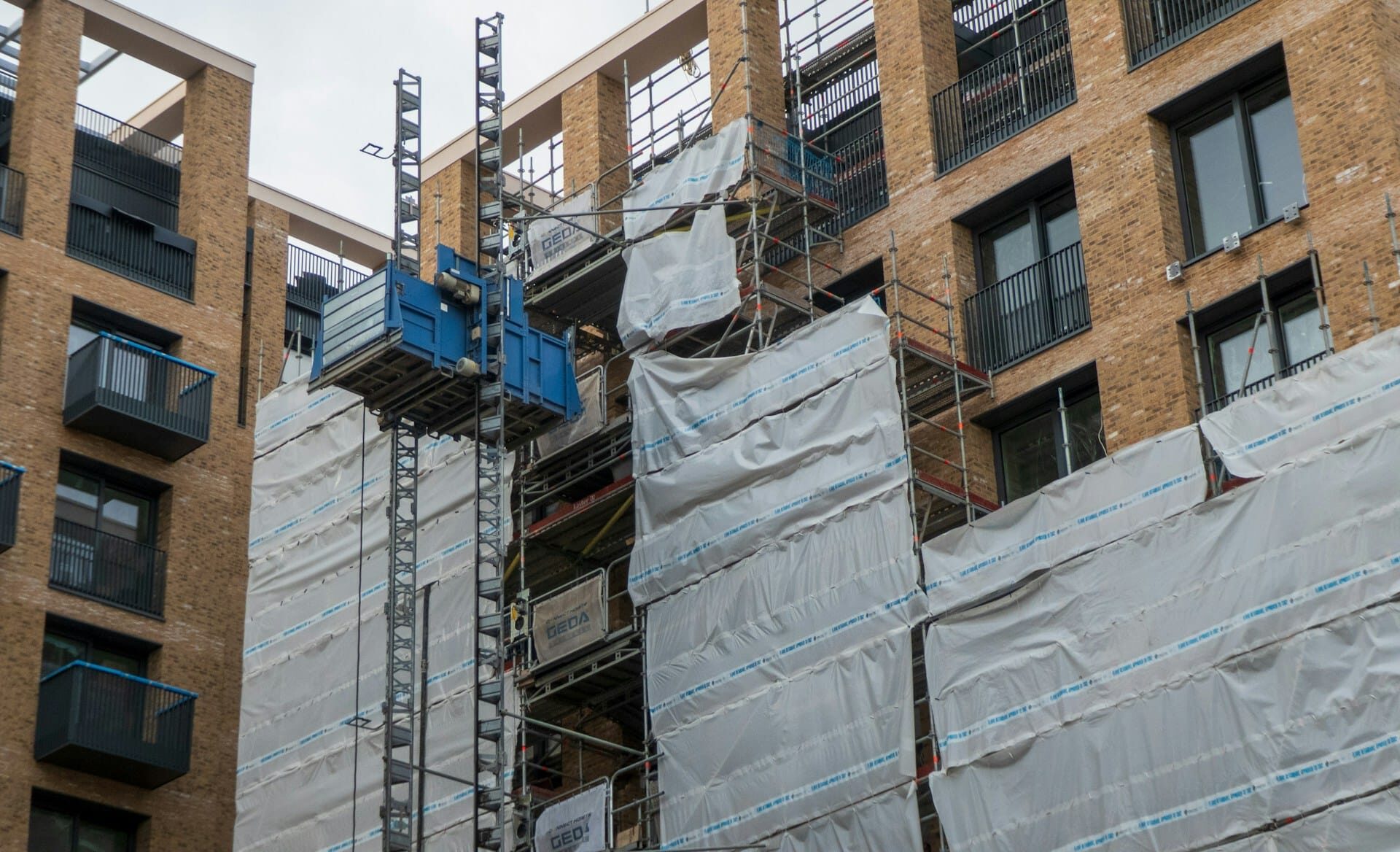A condominium building under construction, representing pre-sale misrepresentations in real estate disputes