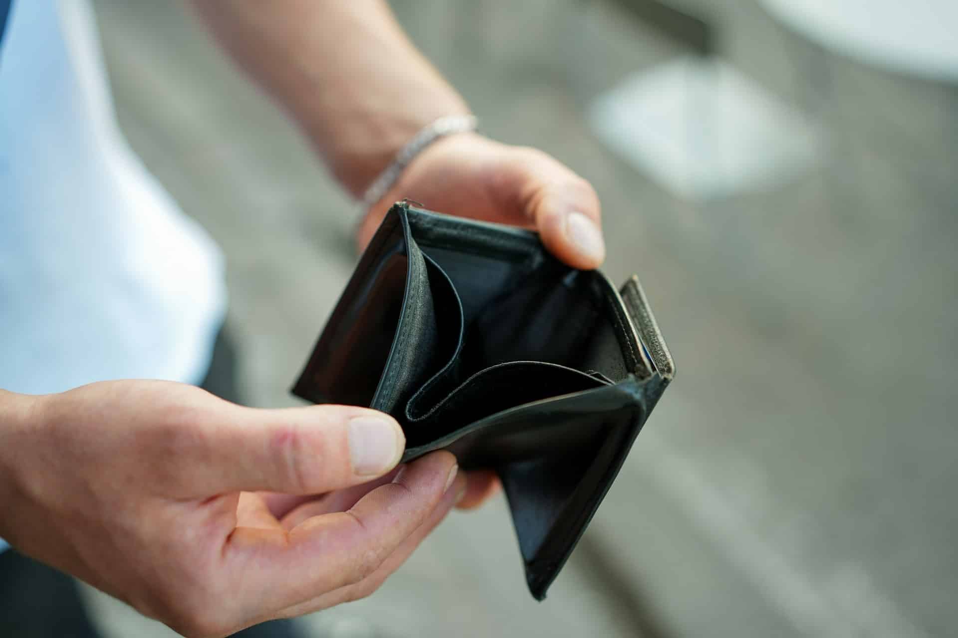 a person holding a wallet