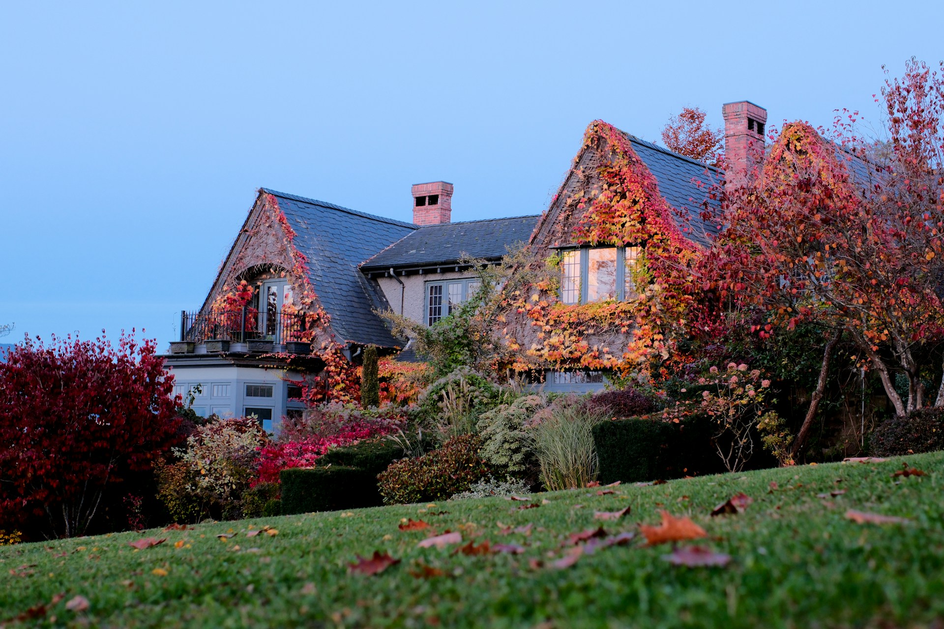 A sprawling Tudor-style mansion in BC during autumn, representing high-net-worth inheritance and divorce in Vancouver, BC