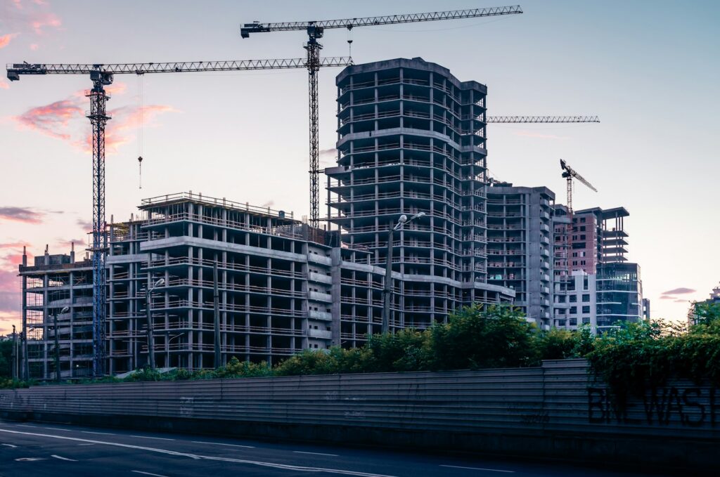 A large-scale property development project at sunset, representing purchaser's liens and Certificates of Pending Litigation in BC.