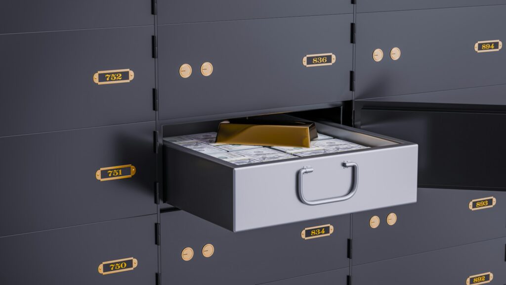 A safety deposit box containing stacks of cash and a gold bar, representing high-net-worth and unequal division of family property and wealth in Vancouver divorces.